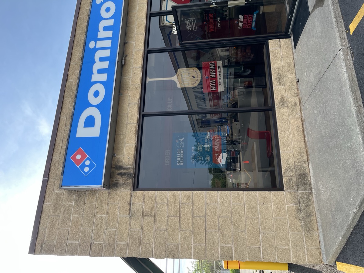 Domino's storefront power washing